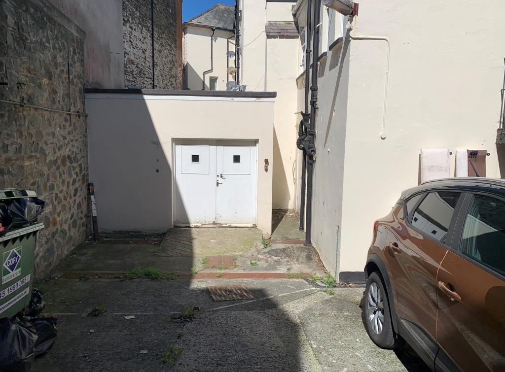 Lot: 24 - TOWN CENTRE STORES AND PARKING SPACE -